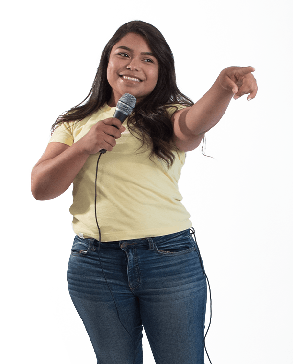 Student holding a microphone and pointing