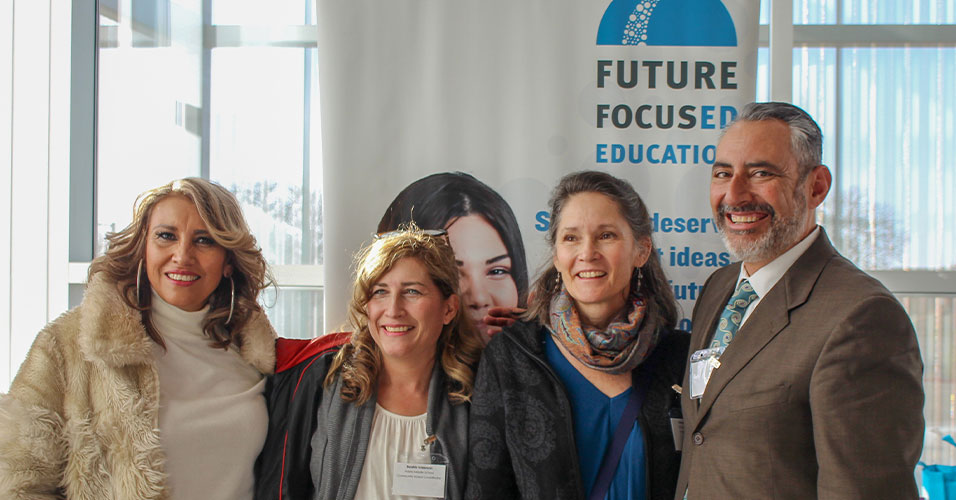Adults smiling at an education event
