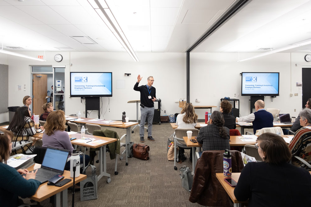 Conference speaker presenting in classroom for EdUp 2023