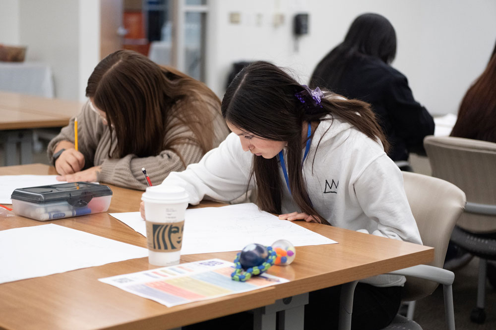 Student working at desk for EdUp 2023