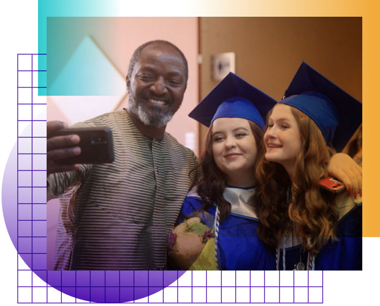 Decorative photo of graduating students taking a photo with a man