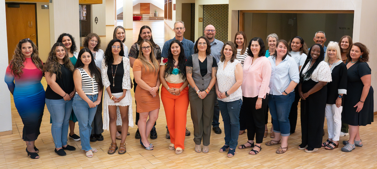 Staff photo with entire team standing together